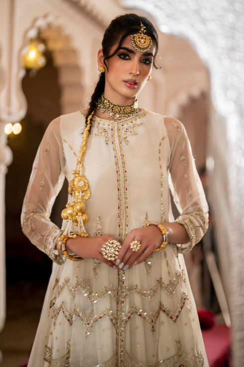 Front close-up of NAQSHI Abeeha frock highlighting neckline design, hand adda embellishment, and pearl white organza fabric