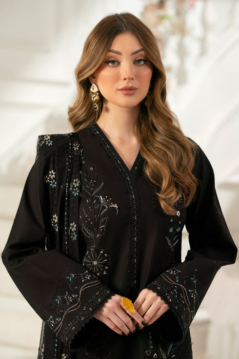Close‑up of NAQSHI Moheeni beaded and embroidered neck pati on black cambric shirt highlighting fine threadwork and beads