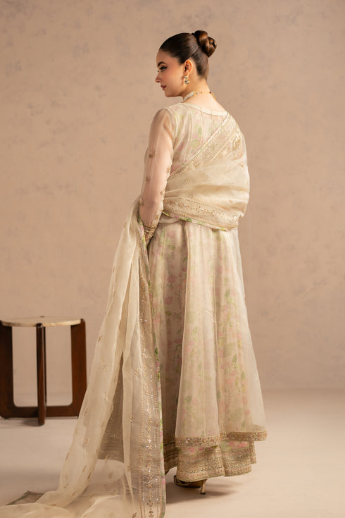 Back view highlighting smooth flare and layered organza fall with inner lining support.