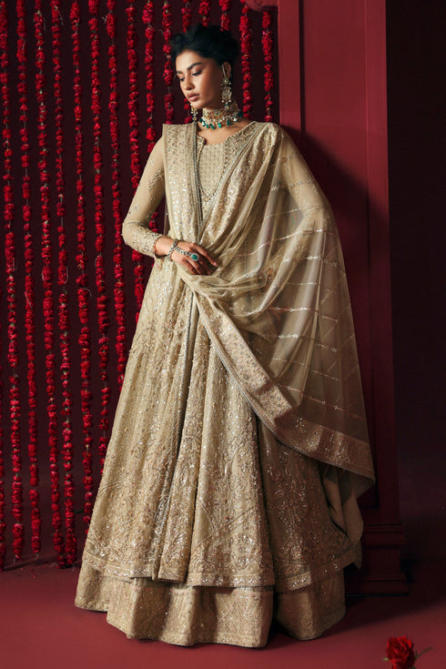 Side profile of NAQSHI Saleha showing lace panel and tassel trim along hem in skin colour