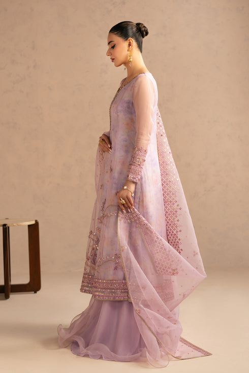 Side walking view showing soft flare of paneled frock and flowing organza dupatta, elegant stitched semi formal eastern dress.