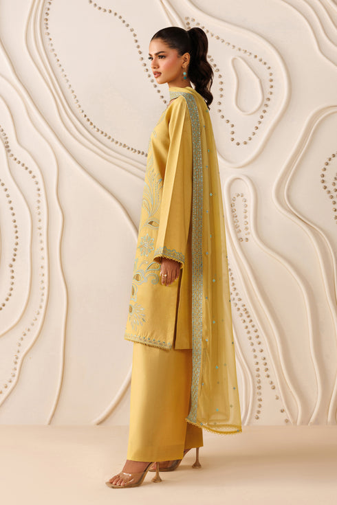 Side standing view of NAQSHI Mary outfit highlighting straight cambric trouser, clean shirt cut, and balanced silhouette