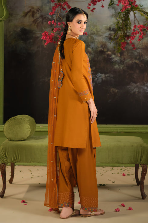 Side view of NAQSHI Ordhni rust embroidered Pima lawn shirt paired with cambric trousers and net dupatta