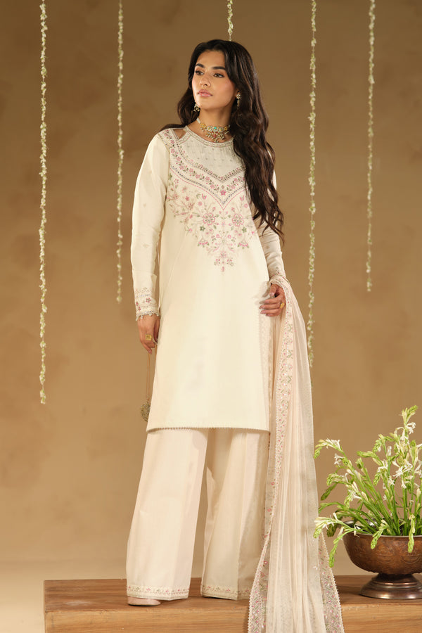 Rafza 3 piece ready to wear Eid outfit in soft skin beige Pima lawn straight shirt with pastel embroidery, culotte trousers and embroidered net dupatta – front full look