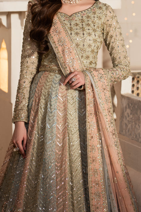 Traditional outfit with intricate patterns and embellishments in a neutral color palette.
