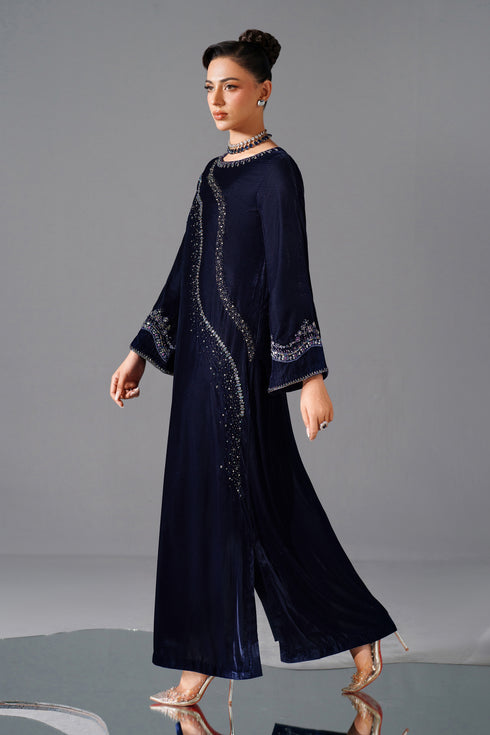 NAQSHI Ellis walking pose — elegant flow of blue velvet outfit