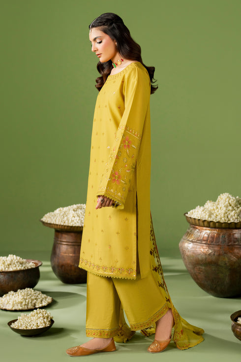 Side standing view of NAQSHI Isha outfit highlighting clean shirt cut, straight trouser, and relaxed summer styling