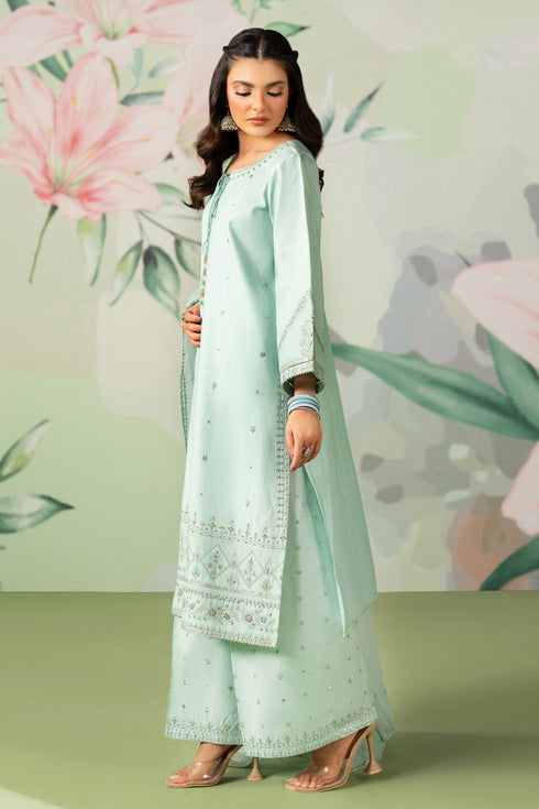 Woman wearing a light green traditional outfit with floral background