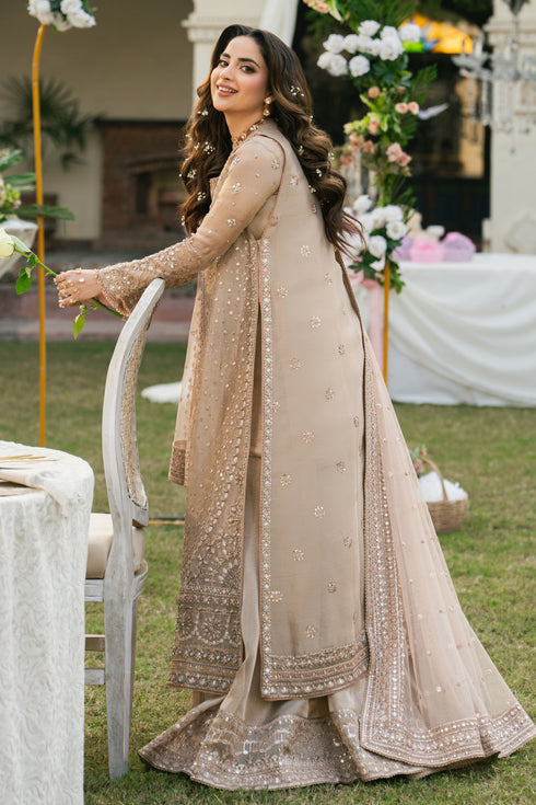 Side angle of Ezaraa formal peach pink tissue lehenga gown with wide flare and soft shine, event-ready bridal outfit