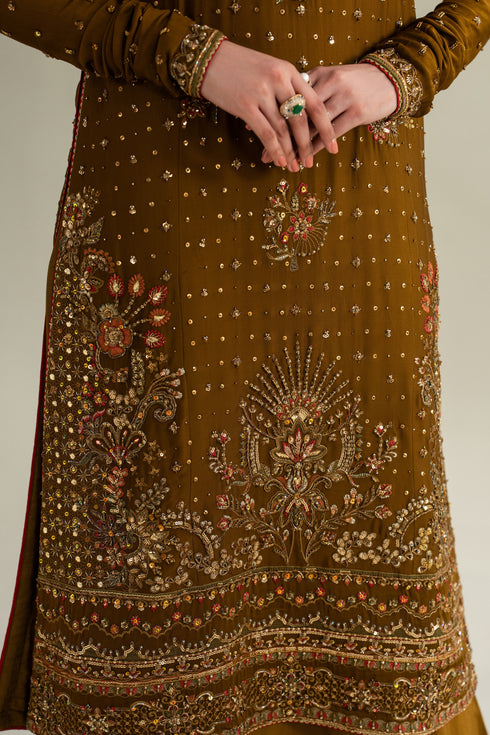 Close-up of deep brown formal shirt showing detailed embroidery and heavy hem border, premium stitching and fabric finish