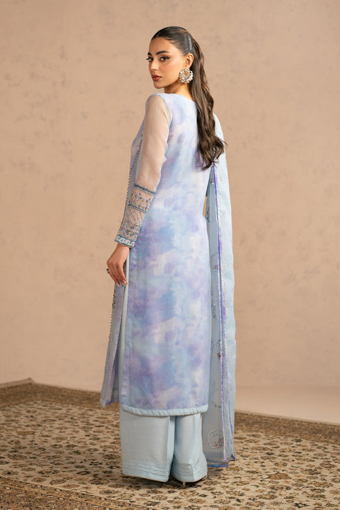 Back view highlighting straight fall of long shirt and clean PK raw silk culottes, modest semi formal eastern outfit.