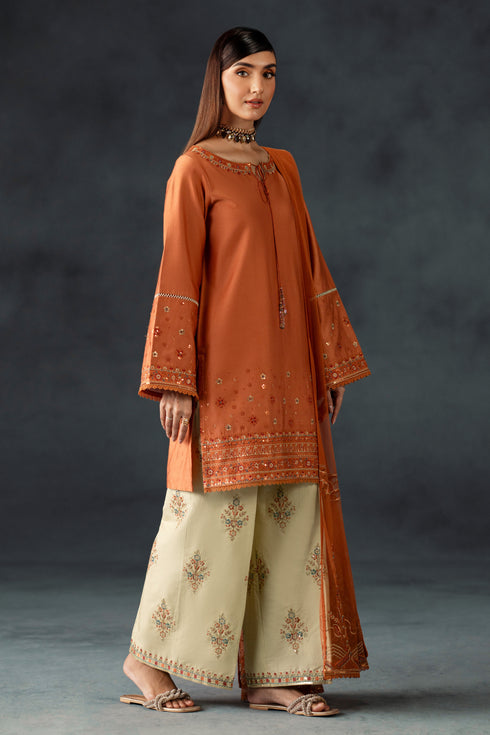 Mira by NAQSHI front view – orange-beige 3PC cotton satin set with sequin panels and tassel sleeves