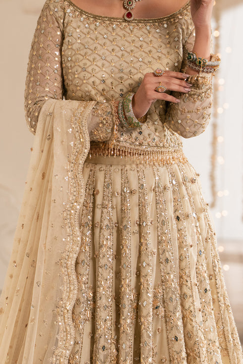 Beige embroidered traditional outfit with intricate detailing