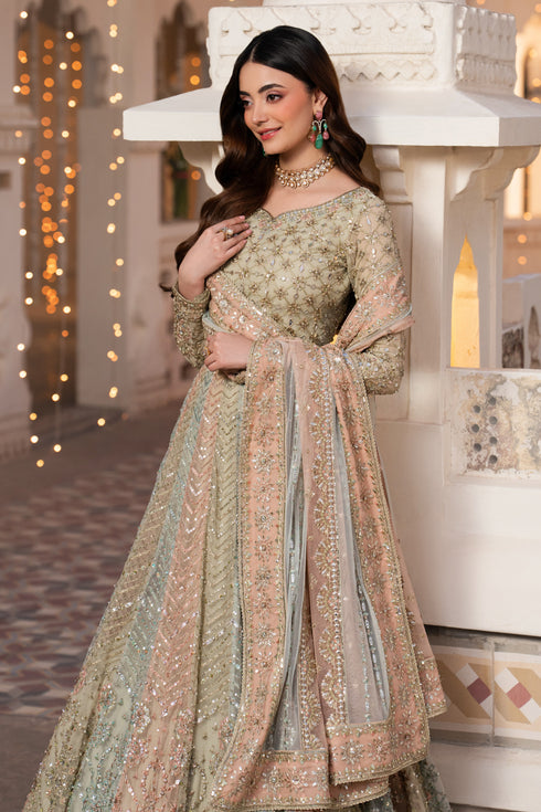 Woman in a traditional embroidered outfit standing in an ornate indoor setting.