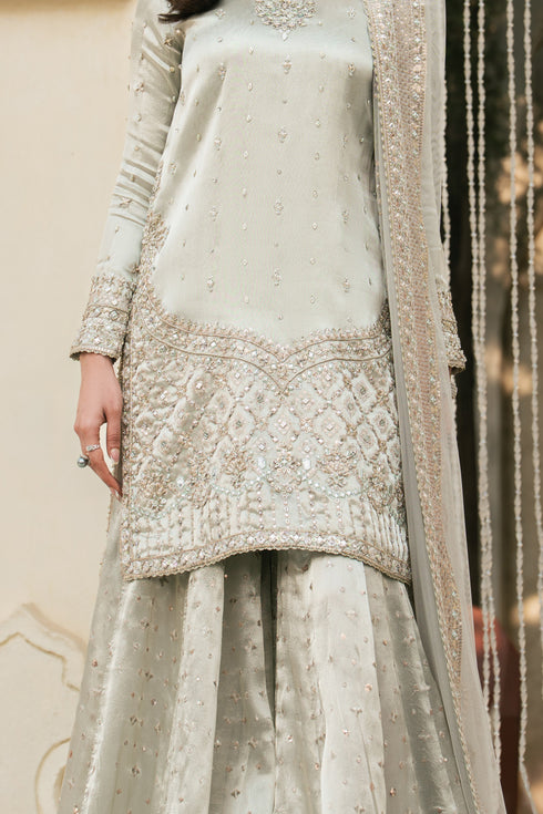 Close-up of mirror and sequin sheet work on Meelina silver tissue shirt and sharara border, fine formal detailing
