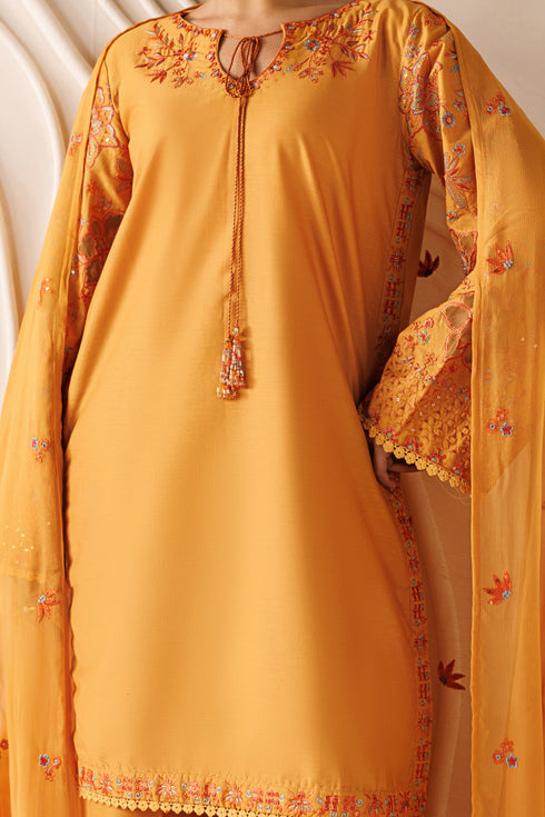 Close-up of NAQSHI Lunara cambric shirt showing embroidered neckline, tassel detail, and soft fabric finish
