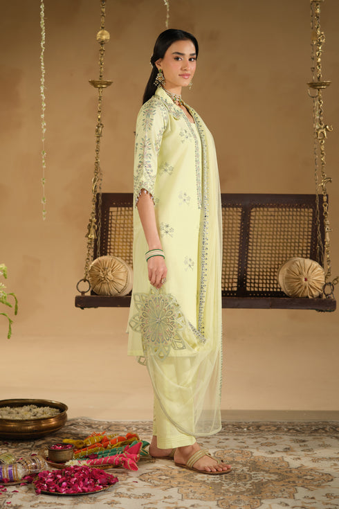 Side view of Nagma Eid dress showing long A-line Pima lawn shirt, plain culotte trousers and soft flowing net dupatta