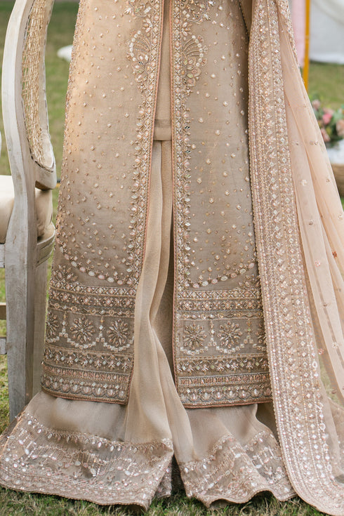 Close-up of mirror and sheet work on Ezaraa peach pink tissue fabric, detailed formal embroidery