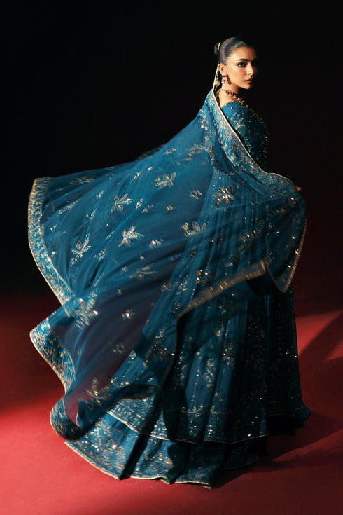 Side profile of NAQSHI Marina in zinc showing full panel flare, adda embroidery and sequined sleeve edge