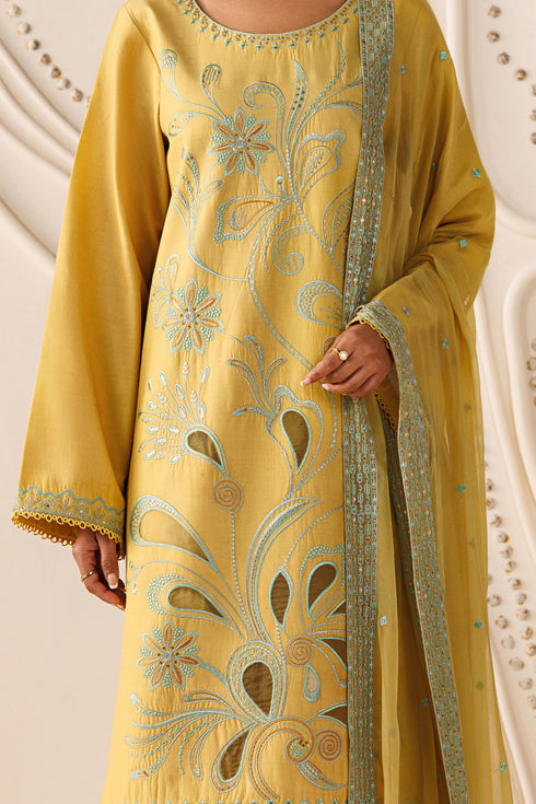 Close-up of NAQSHI Mary cambric shirt showing front embroidery with organza patch details in yellow tone