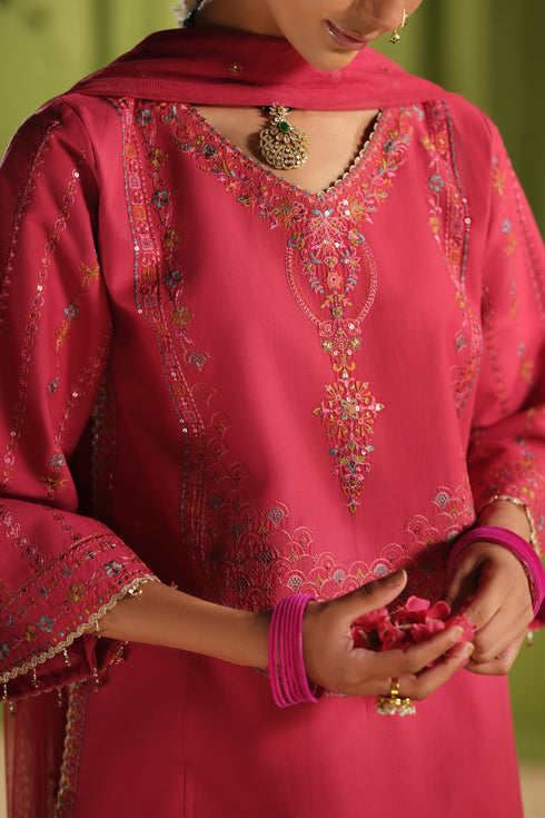 Close view of NAQSHI Kinara carrot pink Pima lawn shirt showing V shaped embroidered neckline and front panel embroidery