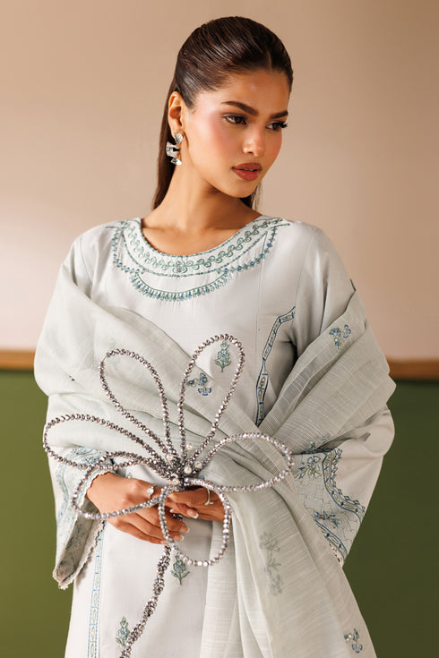 Front close-up of NAQSHI Piper outfit showing embroidered round neckline, loose sleeves, and soft light grey finish
