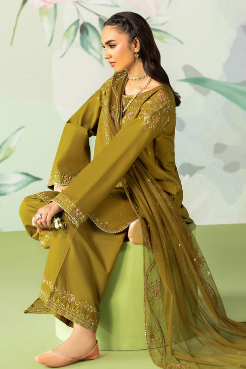 Woman in a green traditional outfit with floral background
