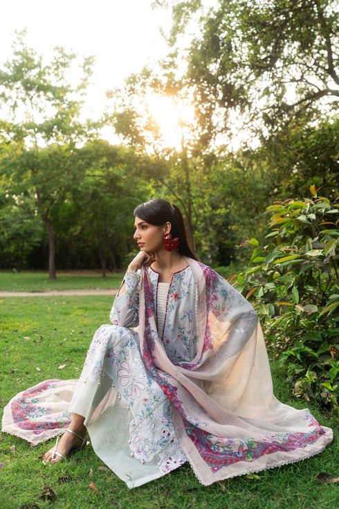 Sitting pose of Zimra grey summer outfit showing straight cambric trouser and relaxed comfortable styling