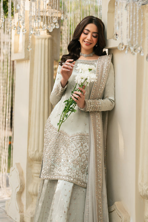 Meelina silver 3-piece formal outfit with tissue shirt, sharara, and net dupatta, polished look.