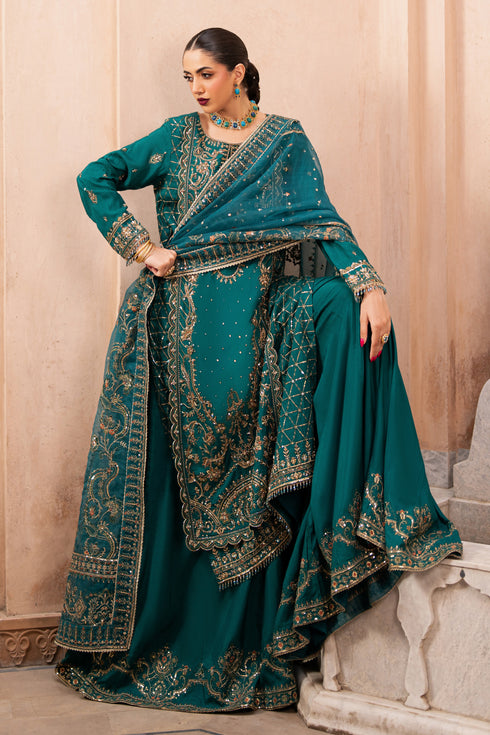 NAQSHI Gul-e-Rimal full outfit with model posing in sharara, organza dupatta, and embroidered shirt