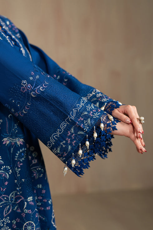 Sleeve close up showing lace finishing and embroidery borders of Atarah suit, detailed summer ready to wear Pakistani outfit.