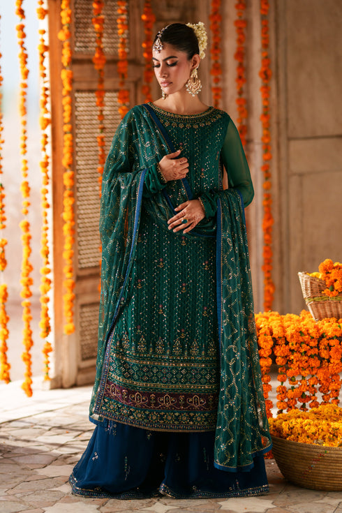 Close-up of Anfa embellished boat neckline with V detail, sequins work and decorative craftsmanship on green crinkle chiffon shirt