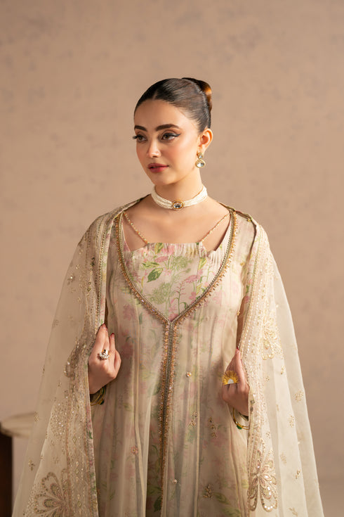 Upper body view focusing on front neckline embellishment and organza texture finish.