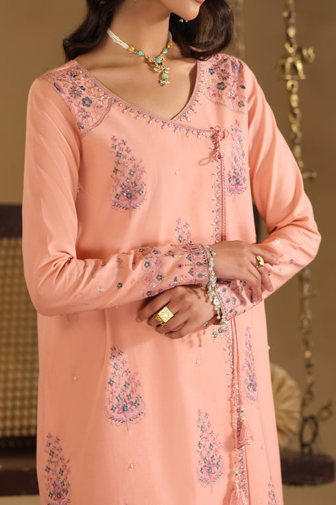 Close up of Umaiza shirt embroidery motifs and sleeve cuff work on pink Pima lawn fabric with soft sequin shine