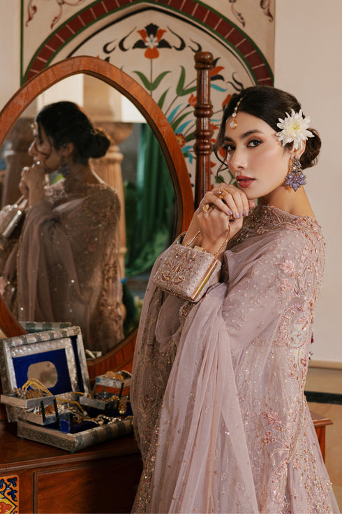 Close‑up of NAQSHI Nihan shoulder embellishments showing detailed stone, crystal, sitara and thread embroidery on sheer organza overlay