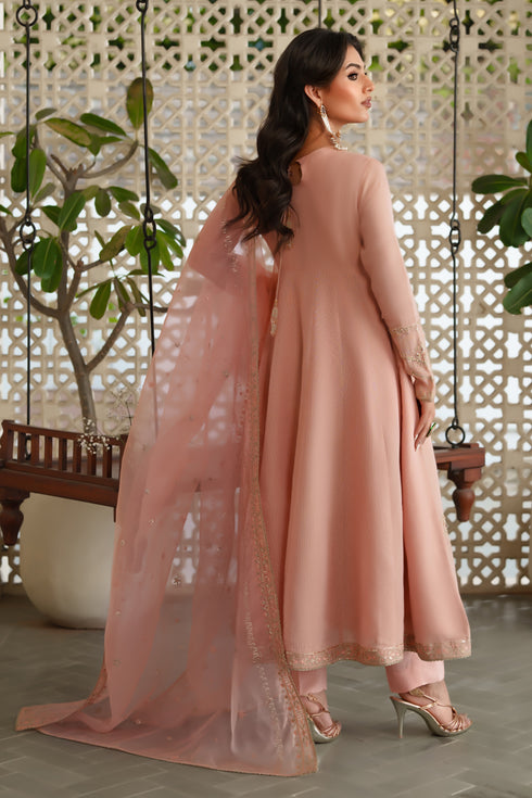Back view of NAQSHI Safron frock highlighting paneled design, embroidery and sequin border