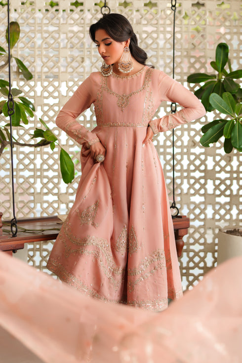Model wearing complete NAQSHI Safron 3PC set: embroidered viscose frock, silk trouser & organza dupatta