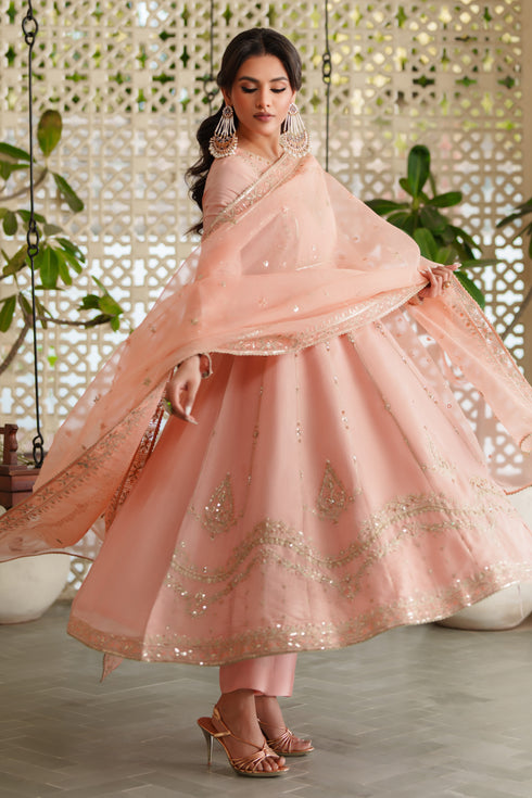 Close‑up of NAQSHI Safron frock neckline showcasing intricate embroidery and shimmering sequin details