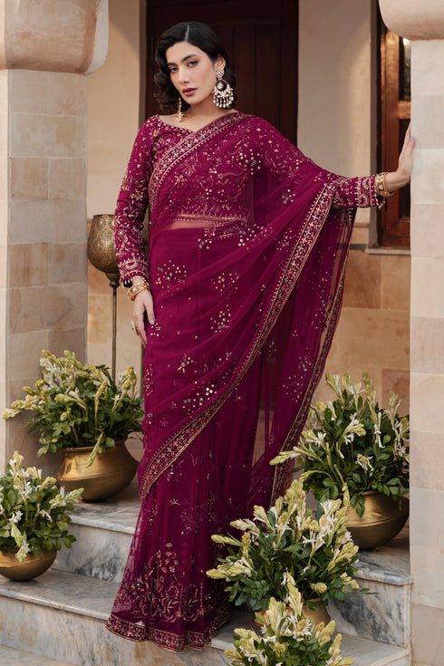 Model wearing NAQSHI Meeru saree with rich burgundy net drape, fully embellished blouse and matching embroidered raw silk petticoat for complete look