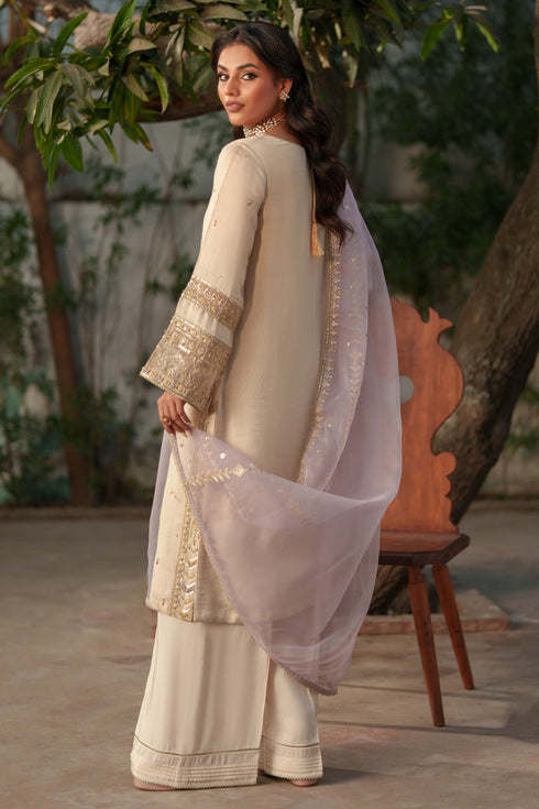 NAQSHI Kai side profile: straight‑cut viscose shirt paired with raw silk culottes silhouette