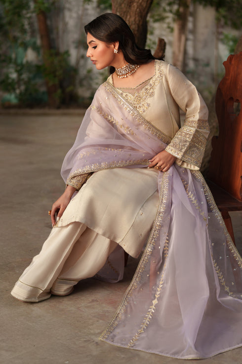 Model wearing NAQSHI Kai 3PC set: viscose shirt, silk culottes & embroidered lilac organza dupatta