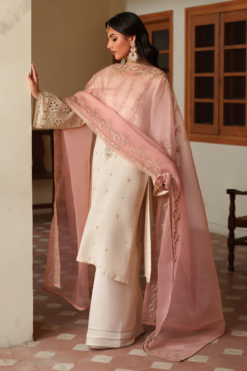 Side profile of NAQSHI Annie showcasing organza-patched cut‑work sleeves and detailed embroidery