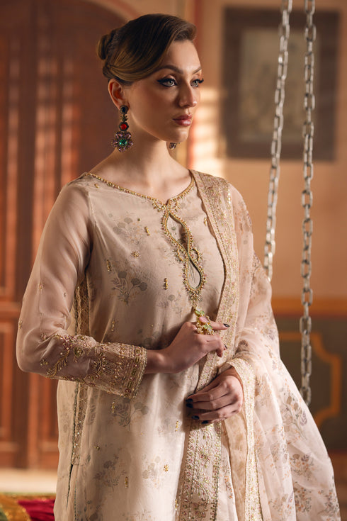 NAQSHI Shifa beige formal outfit with printed organza dupatta, embroidered borders, and graceful layered shirt design.