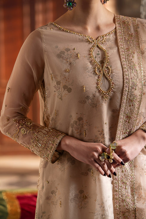 Close detail of NAQSHI Shifa beige shirt showing boat neckline with embroidery, sequins, and refined adda work.