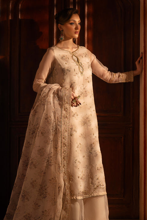 Front view of NAQSHI Shifa beige 3PC ready to wear outfit highlighting double layer shirt, elegant embroidery, and flared trouser shape.