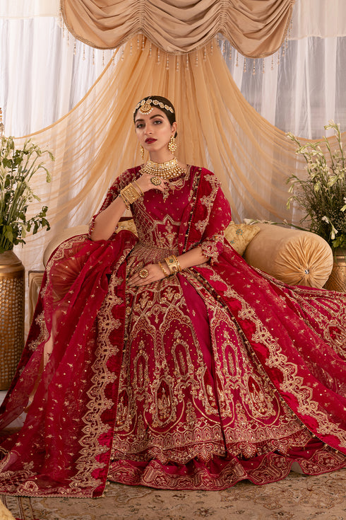 Side view of Geeti Aara frock showcasing floor‑length flare, velvet patch detailing, and richly embroidered tilla motifs.