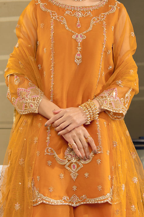 Close-up of NAQSHI Zaryaab short shirt showing embroidery, cutwork details, and fine organza finishing