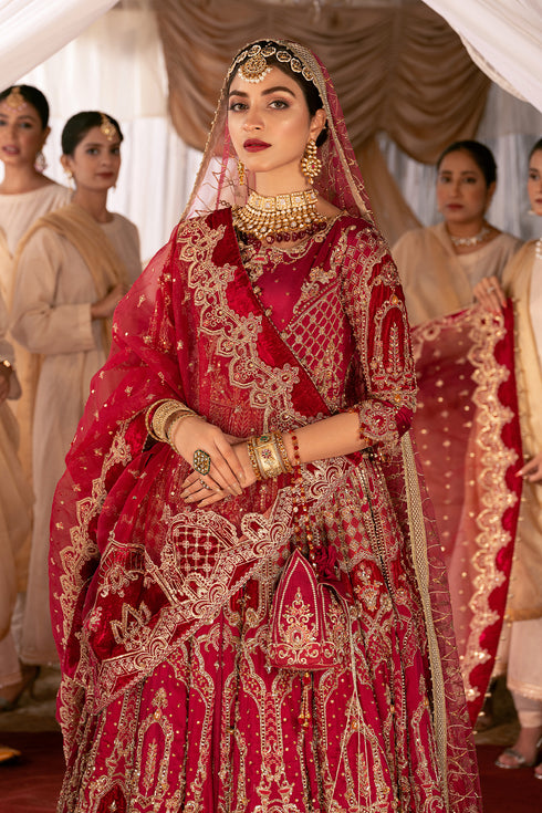 Naqshi Geeti Aara fuchsia‑red raw‑silk front‑open frock with dense tilla and sequin embellishments, paired with ruffled raw‑silk lehenga, velvet‑patched organza dupatta.