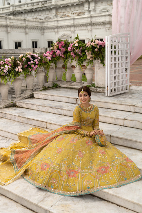 Close-up showing vintage floral border, Victorian arch jaal and heavy gotta work along lehenga hem