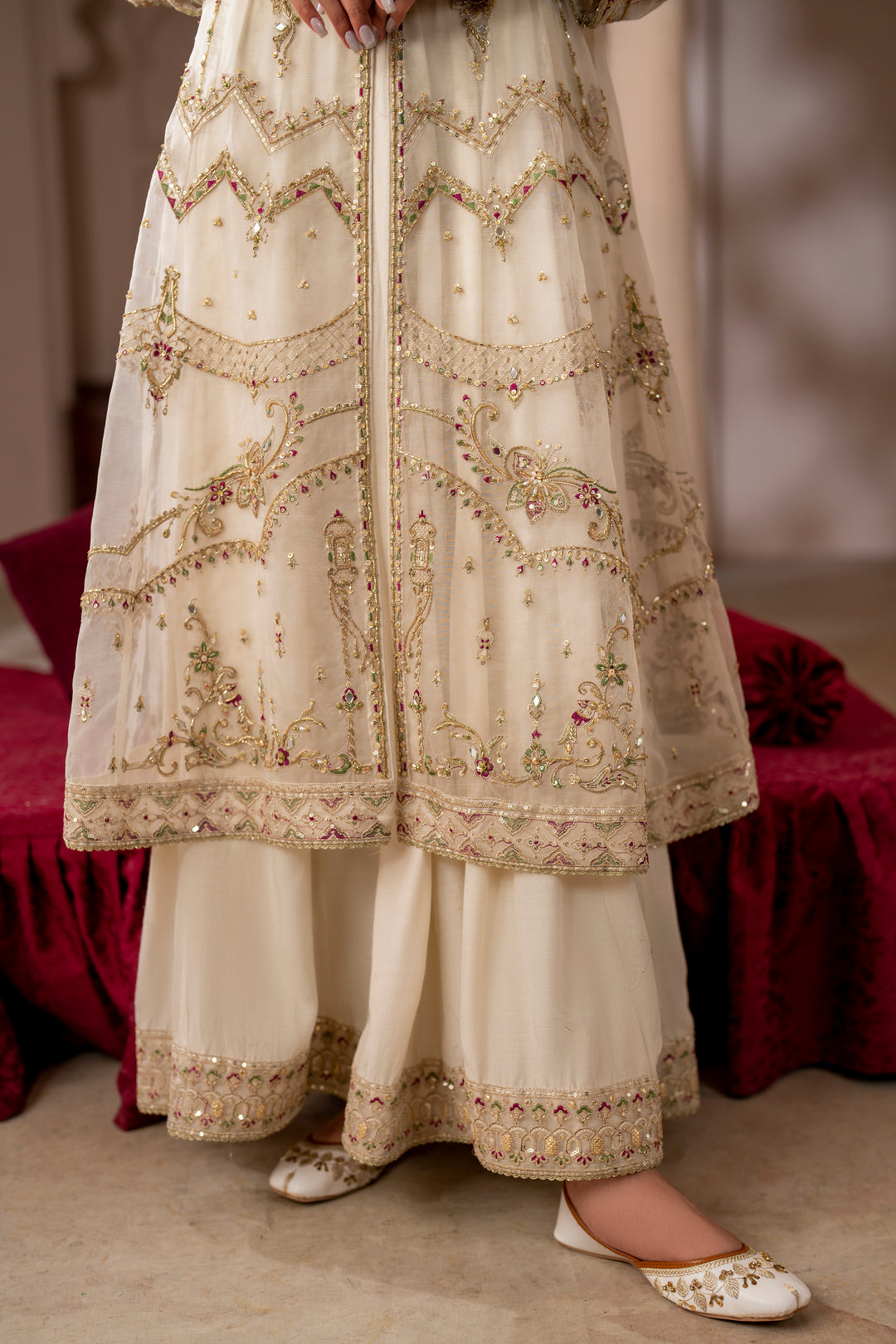 Lower detail of NAQSHI Abeeha outfit showing embroidered frock hem, straight PK raw silk pants, and neat finishing